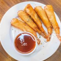 Shrimp In The Blanket (5 Pcs) · 5 Pieces of shrimp wrap in egg roll papers and fry serve w/ our spring roll sauce on the side.