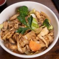 Pad Zu Noodles · Wide rice noodles stir fried with broccoli, carrots, cabbage, mushrooms, egg, and home-made ...