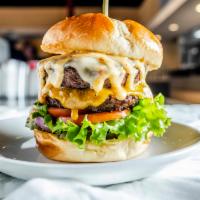 The Duval · Two houses seasoned all beef patties topped with choice of two cheeses, pickle chips, crispy...