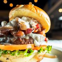 The Black N' Bleu · House seasoned all beef patty topped with sliced blue cheese, pecan wood smoked bacon, honey...