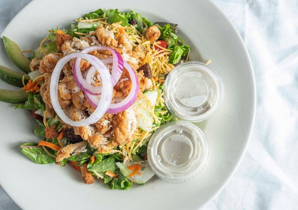 Jumpin' Jax Salad · House salad mix with topped with grape tomatoes, cucumber, red onions, shredded carrots, shredded cheddar cheese, fried chicken, topped with our house-made garlic herb croutons, and fresh avocado slices.