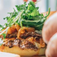 Sweet And Spicy · Angus beef patty, crispy bacon, guava jelly, goat cheese, spicy sauce and fresh arugula.