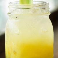 Kiwi Sunset Mocktail · lime, orange juice, kiwi, agave, mint, sparkling water
