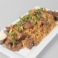 Arroz Al Wok Especial De Carne · Fried rice with beef, vegetables and eggs.