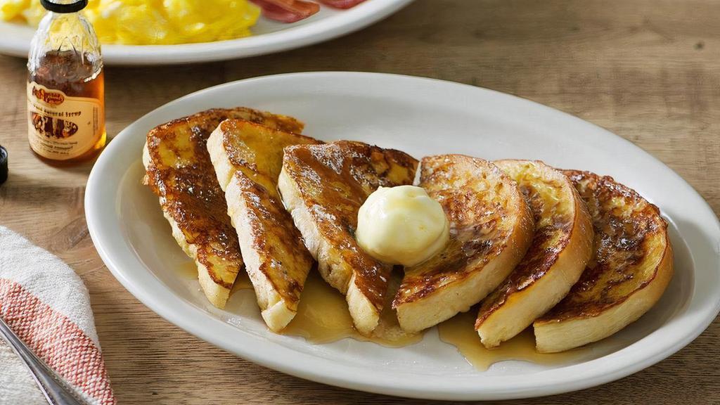 Momma'S French Toast Breakfast® · Six pieces of our Sourdough bread hand-dipped in eggs and grilled, topped with butter and served with two eggs*. Plus Thick-Sliced Bacon or Smoked Sausage and 100% Pure Natural Syrup..