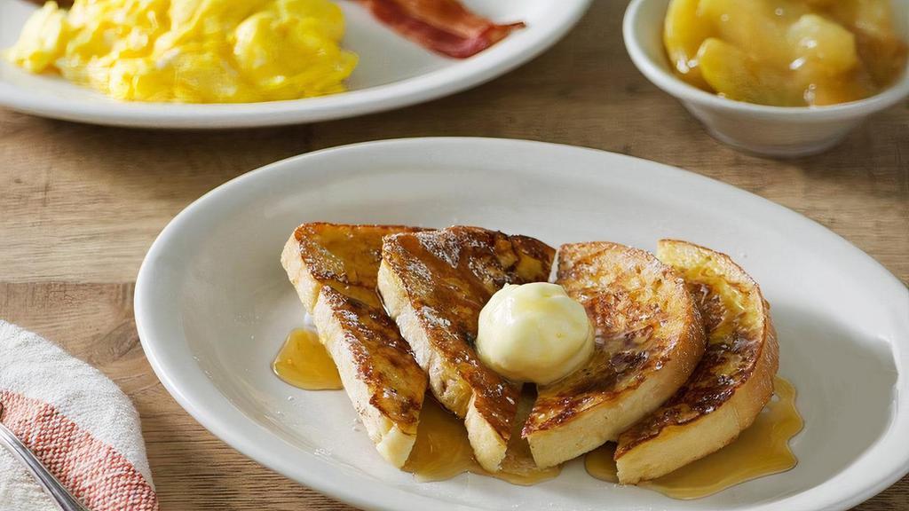 Grandma'S Sampler French Toast Breakfast · Four pieces of our Sourdough bread grilled and topped with butter, two eggs* and a sampling of Bacon, Smoked Sausage and Ham. Plus choice of Breakfast Side and 100% Pure Natural Syrup.