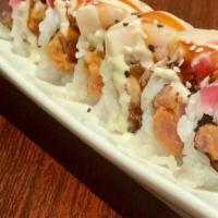 Twister · Spicy tuna and tempura flakes topped with tuna, walu, wasabi mayo and eel sauce.