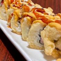Yummy Roll · Flash fried tuna, salmon and cream cheese topped with spicy mayo, eel sauce and ponzu.
