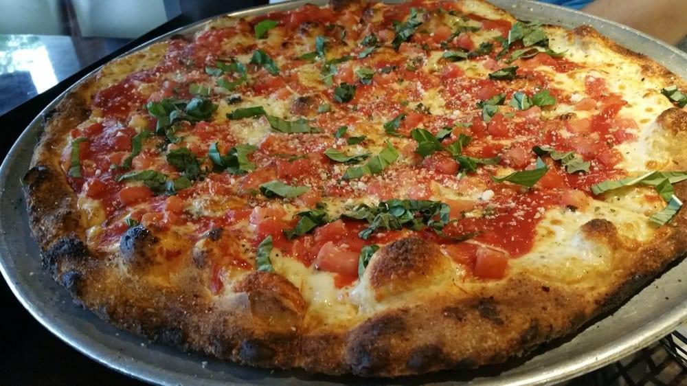 Margherita · Mozzarella, pizza sauce, fresh tomatoes, basil & garlic