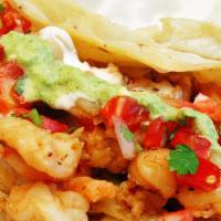 Taco De Camarón  /  Shrimp · Two corn tortillas with shrimp, onion, and cilantro. Served with your favorite salsa