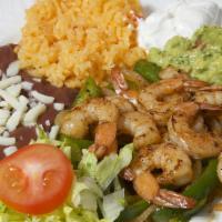Shrimp Fajitas · Shrimp served with peppers onions, Mexican rice, refried beans and corn tortillas.