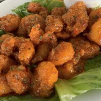 Boom Boom Shrimp(Cal 540) · Hand-breaded Gulf shrimp tossed in our tangy boom boom sauce.