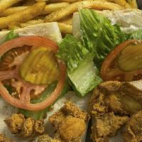 Oyster Po Boy (Cal 900) · Dressed with mayonnaise, lettuce, pickles and tomatoes and served with French Fries.
