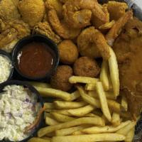 Seafood Basket (Cal 1100) · Shrimp, fish, oysters and stuffed crab served in a basket with fries, two hushpuppies, one c...