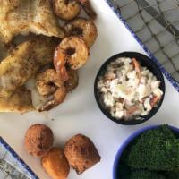 Combo Basket (Cal 955 To 1100) · Handbattered and lightly fried, served with our signature shrimp slaw, two hushpuppies, a co...