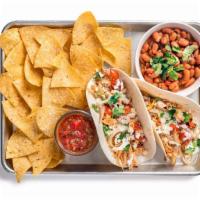 Chicken Tinga Taco Plate · Two tacos (1 flavor) containing chicken tinga, roasted onion and tomato, and crema. Served w...