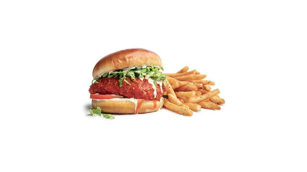Buffalo  · Breaded rotisserie chicken breast, flash-fried and tossed in tangy buffalo sauce, topped with lettuce, tomato, and your choice of blue cheese or ranch dressing.