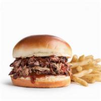 Brisket · 1/4 lb pulled brisket on a toasted bun, served with yellow onions, pickles, and BBQ sauce. S...