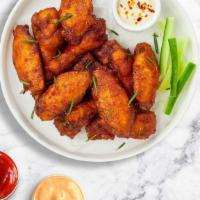 Colossal Classic Wings (Plain) · Fresh chicken wings baked until golden brown. Served with a side of ranch or bleu cheese.