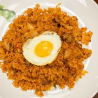 Kimchi Fried Rice · Spicy pork, kimchi, white rice, green onion, fried egg and sesame seed.