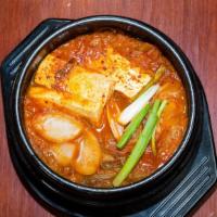 Kimchi Stew With Pork · Tofu, pork, kimchi, green onion, rice cake and spicy beef broth.