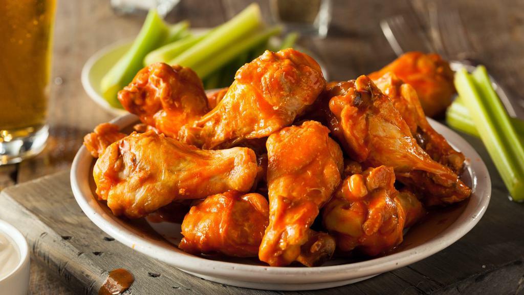 Hot Wings · Fresh oven-baked hot flavored chicken wings. Choice to make it crispy! Free Ranch or Bleu Cheese dressing.