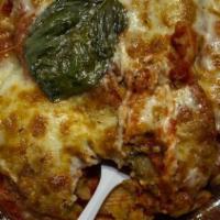 Eggplant Parmigiana · Homemade marinara sauce, famous penne, spaghetti pasta topped with melted Mozzarella, garlic...