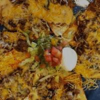 Grilled Nachos Supreme · Flour tortilla chips covered with our white cheese with your choice of grilled meat, refried...