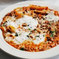 Lasagna Coco Pazzo · Fresh cut pappardelle, ricotta, mozzarella and Parmigiano-Reggiano cheeses topped with our s...