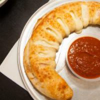 Stuffed Breads · Hand-rolled with mozzarella and your choice of anyone topping of our toppings and served wit...