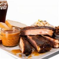 Rib Plate · Served with two sides and one 20 oz. drink.