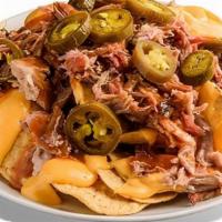 Stadium Nachos · A game day staple! Tortilla chips covered with nacho cheese, Dreamland BBQ Sauce, & jalapeño...
