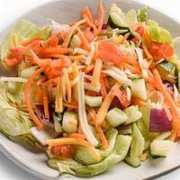 Farmhouse Side Salad · Tomatoes, cucumbers, onions, carrots, & shredded cheeses. Served on a bed of iceberg & romai...