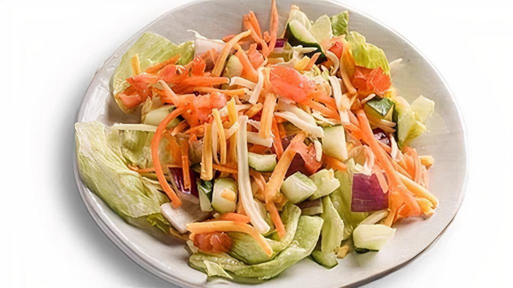 Farmhouse Side Salad · Tomatoes, cucumbers, onions, carrots, & shredded cheeses. Served on a bed of iceberg & romaine lettuce.
