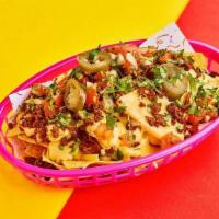 Pulled Beef Barbacoa Loaded Nachos · Crispy corn tortilla chips with pulled beef barbacoa, shredded cheese, jalepeno, pico de gal...