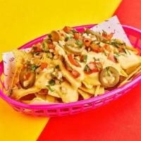 Small Nachos · Crispy corn tortilla chips with shredded cheese, queso, pickled jalapeno, cilantro, and your...