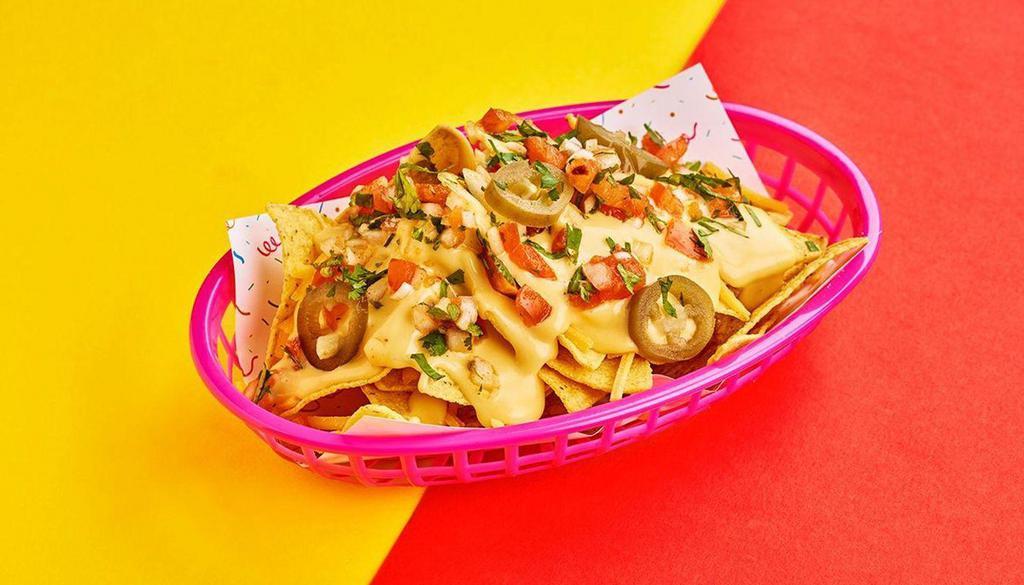 Small Nachos · Crispy corn tortilla chips with shredded cheese, queso, pickled jalapeno, cilantro, and your choice of sauce.