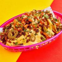 Beyond Meat Loaded Nachos · Crispy corn tortilla chips with plant-based Beyond Meat, queso, pickled jalapeno, cilantro, ...