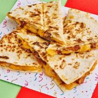 Chicken Tinga Quesadillas · Chicken Tinga with shredded cheese, queso, and your choice of sauce.