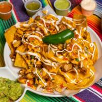 Nachos · Corn tortillas chips with layer of refried beans, chopped chicken, or vegetarian, nacho chee...