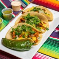 Three Tacos · Soft corn tortilla with your choice of meat. Minimum order of three tacos.