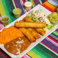 Flautas (3 Pcs) · Rolled and fried corn tortillas filled with chicken. Served with lettuce, tomatoes, sour cre...