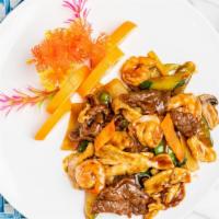 Triple Delight · A unique combination of shrimp, chicken and beef sautéed quickly with vegetables in tasty br...