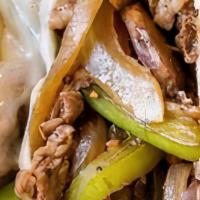 Philly Cheese Steak · Juicy Angus steak shaved into slices , with sautéed onions , mushrooms , and peppers , on a ...
