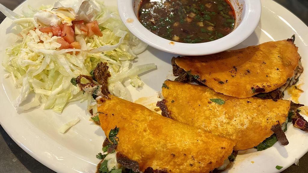Tacos De Birria · Three brisket tacos,with cilantro ,onion,served with rice and soup