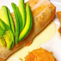 Baja Fried Burrito · filled with shrimp,  fish, tomatoes,onion,cilantro,topped with chesse and avocado. served wi...