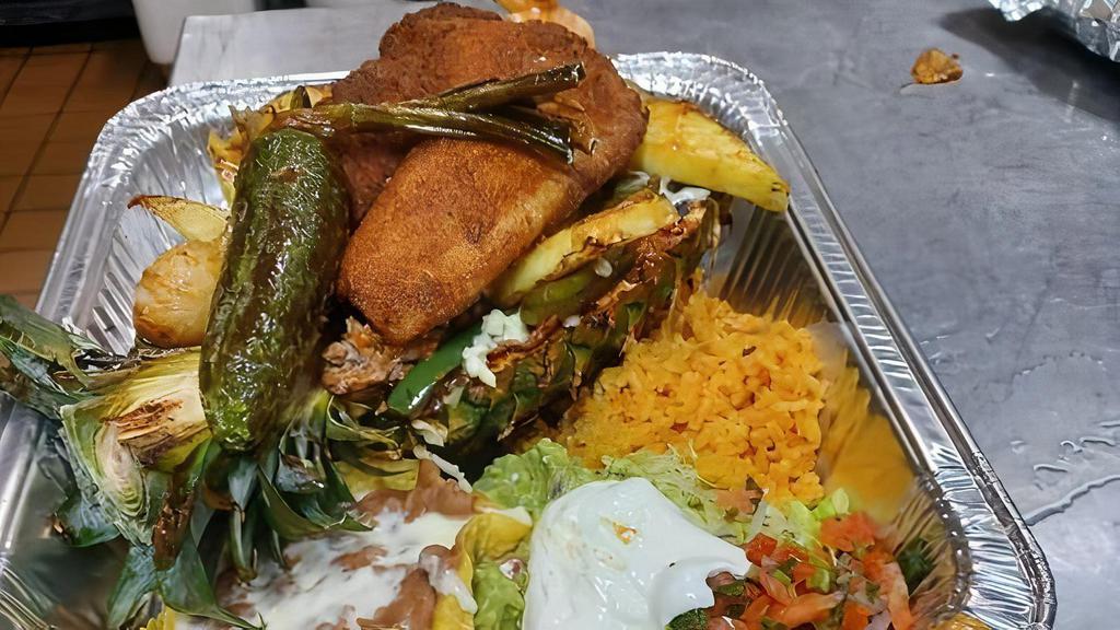 Aztec Fajitas · served on pineapple ,steak,chicken,shrimp,carnitas,tilapia and cheese.