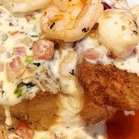 Tilapia Azteca · tilapia on the bed of rice covered with creamy shrimp