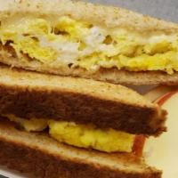 Morning Nomster · Eggs and cheese on a toasted whole wheat side of apples and oranges.