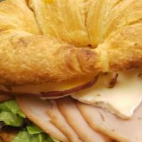 The O'Keefe · Deli turkey, brie, sliced apple, spring greens, honey mustard on croissant, with a side of c...